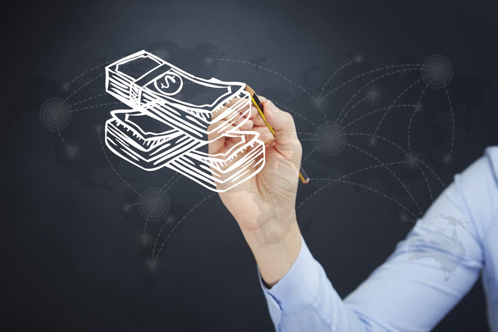 A person sketches stacks of dollar bills with a pencil on a dark background, highlighting a faint world map and interconnected lines, symbolizing global financial connectivity—an inspiring image for how to make money from your podcast.