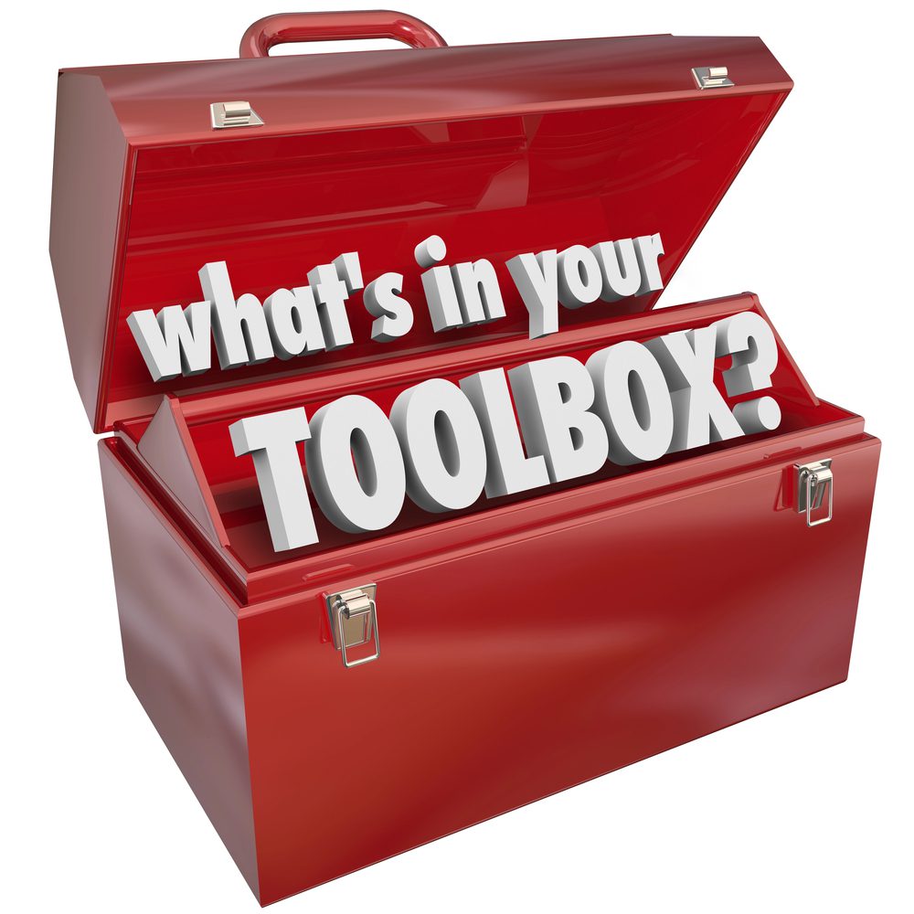 A red toolbox with an open lid reveals 3D text that asks, Whats in your social media tools toolbox?.