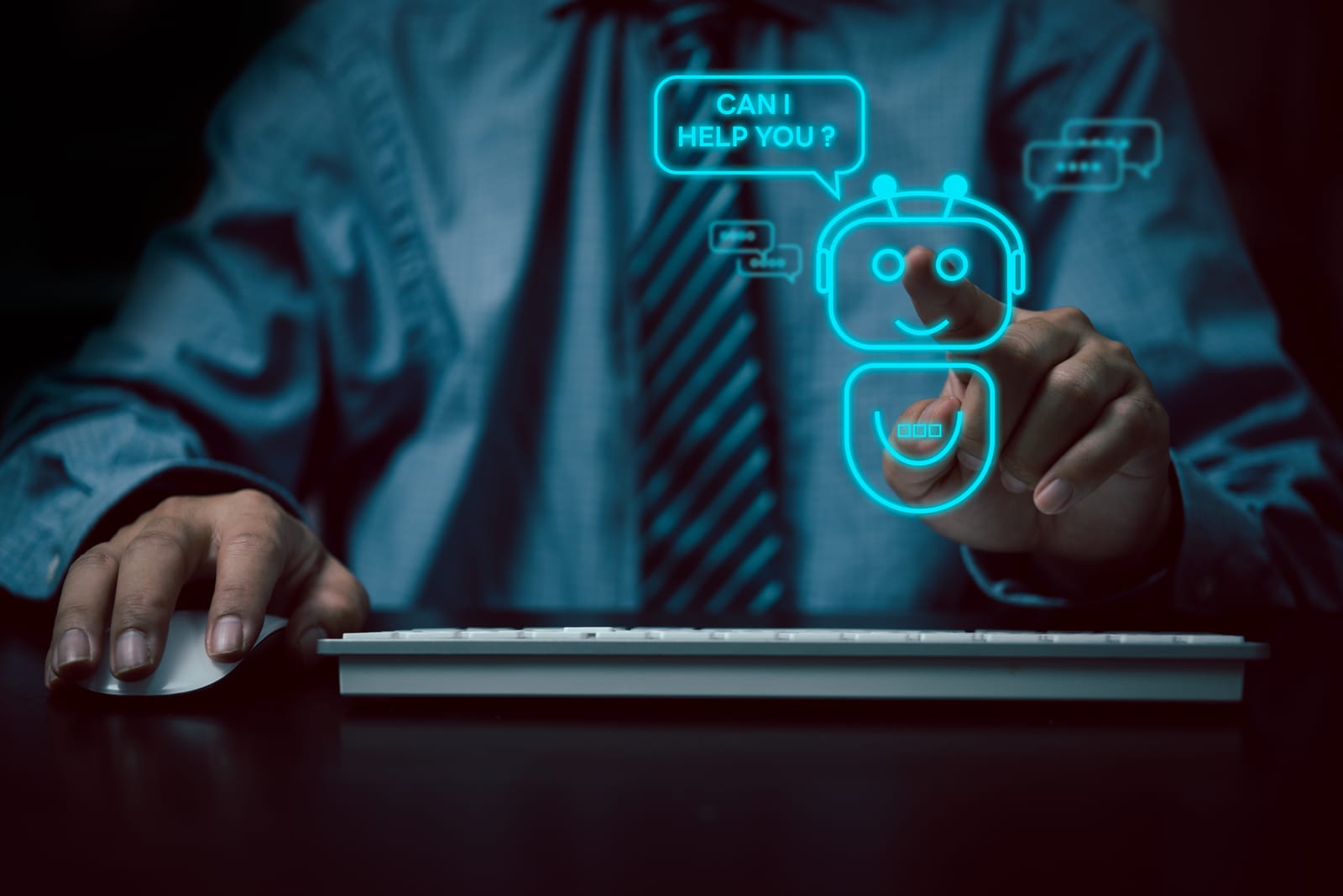 A person interacts with a virtual assistant hologram, showcasing AI in marketing. The hologram displays a friendly robot with a speech bubble saying, CAN I HELP YOU? The person wears a blue shirt and tie, one hand on a keyboard and the other pointing at the hologram.