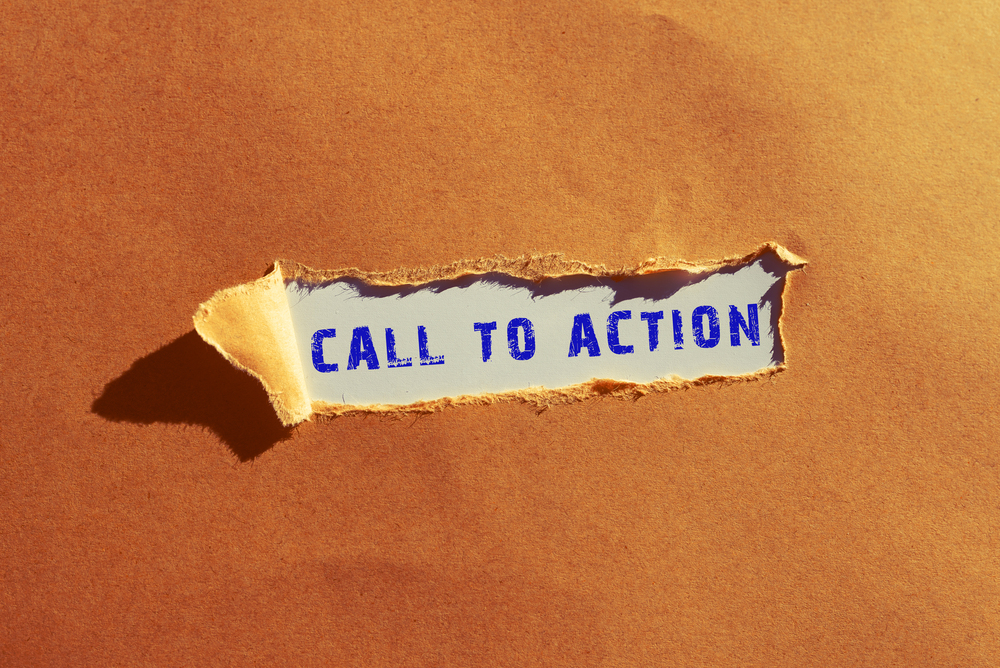 A piece of brown paper is torn open to reveal the words CALL TO ACTION written in bold blue letters underneath, symbolizing the power of podcast marketing and effective podcast calls to action.