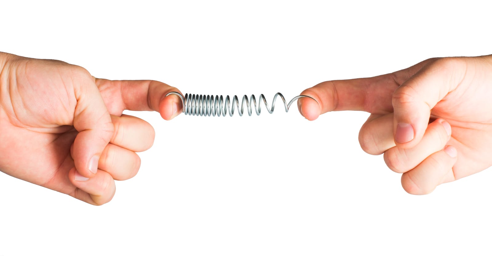 Two hands each hold one end of a stretched metal spring, pulling it in opposite directions against a white background—inviting the idea of your listener's why.